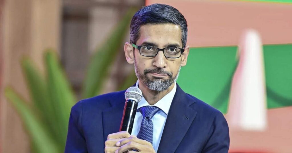 Sundar Pichai delivering a keynote presentation on stage.